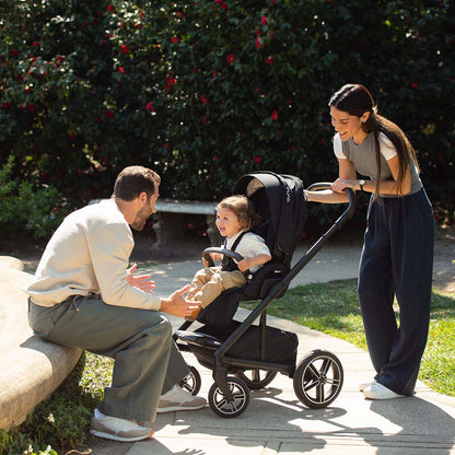 Nuna MIXX NEXT stroller in caviar black with a child seated inside showing a comfortable ride solution