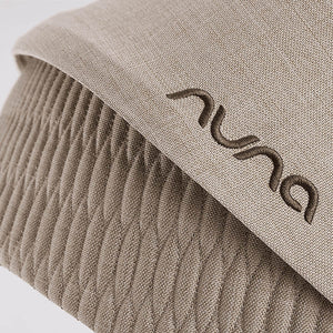 Beige textured fabric hat with embroidered nuu logo designed for nuna mixx next stroller cosmopolitan accessory