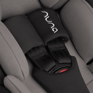 Black nuna seat belt cover with silver embroidered logo and red buckle accent for nuna arra flex car seat