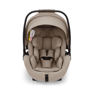 Beige nuna arra flex car seat with sleek modern design padded fabric upholstery and flat recline i-size baby seat
