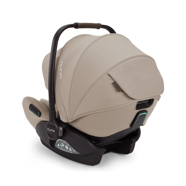 Beige nuna arra flex car seat with black frame and accents flat recline i-size seat for babies 0 to 13kg
