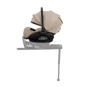 Beige and black nuna arra flex car seat with sleek modern design and flat recline i-size for up to 13kg babies