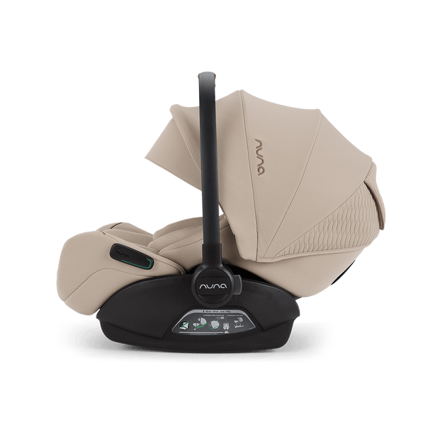 Beige nuna arra flex car seat with black handle and base designed for flat recline i-size baby safety up to 13kg