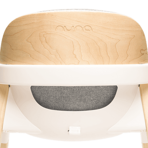 Nuna BRYN highchair with light maple wood top white plastic frame and gray fabric seat in modern design heritage bundle