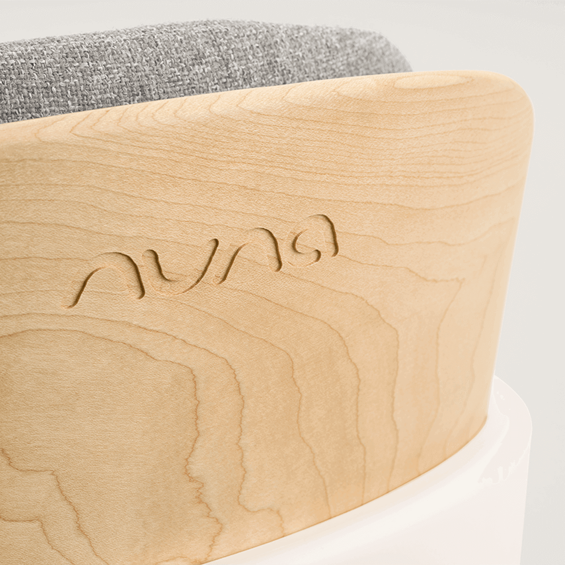 Light-colored wooden frame with subtle grain and auna engraving on the back of nuna bryn highchair heritage model