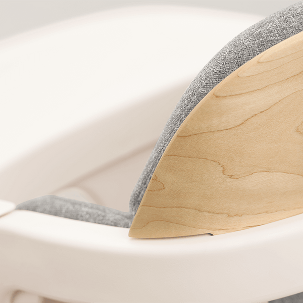 A modern nuna bryn highchair and newborn rocker bundle with white plastic frame gray fabric and light wood accent panel