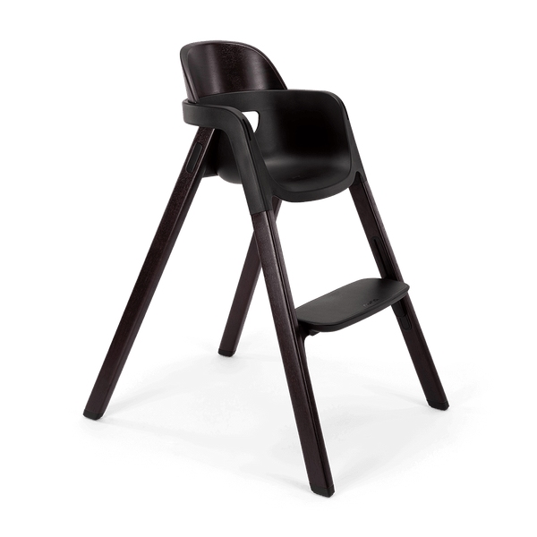Dark brown wooden Nuna BRYN highchair with sleek modern design and integrated footrest for comfortable seating