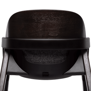 Nuna BRYN highchair metro in black avent with a textured seat and wooden legs for baby feeding