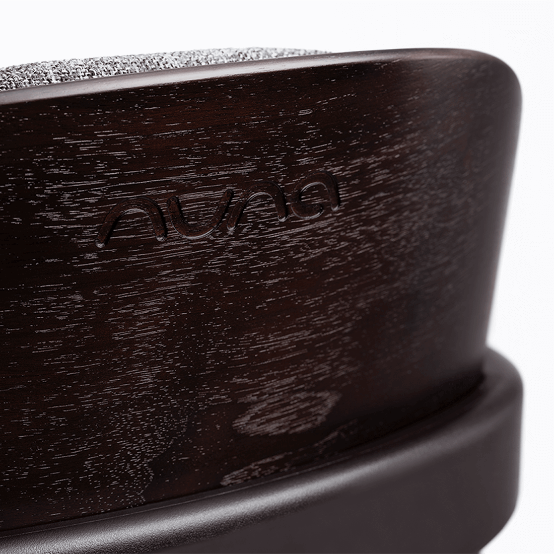 Dark wood-finish nuna bryn highchair metro with textured gray fabric top baby car seat base shown from back side