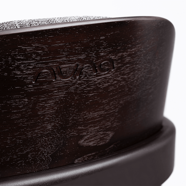Dark wood-finish nuna bryn highchair metro with textured gray fabric top baby car seat base shown from back side