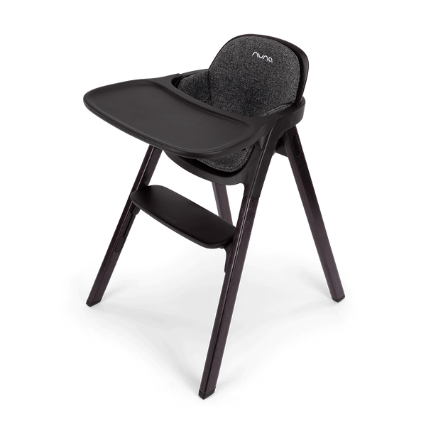 Black nuna bryn highchair metro with textured gray fabric seat and tray for comfortable baby seating