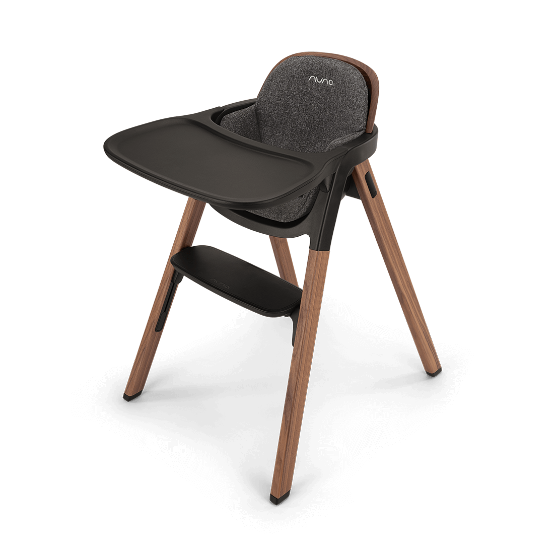 Modern nuna bryn highchair with wooden legs dark gray fabric seat and black tray for toddler dining use