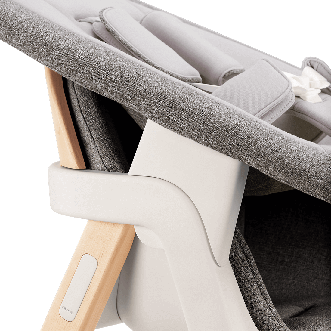 Nuna BRYN newborn rocker in gray textured fabric with light wood frame and white plastic accents for infant comfort