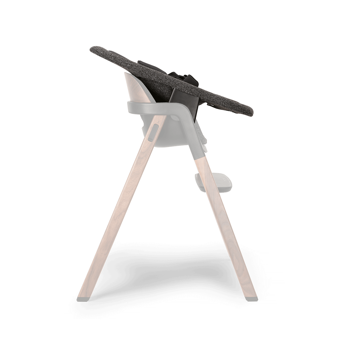 Modern high chair with dark gray textured fabric seat supported by wooden legs and black plastic joints Nuna BRYN newborn rocker