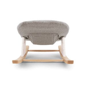 Nuna bryn newborn rocker with gray textured fabric seat and light wood frame with white plastic accents