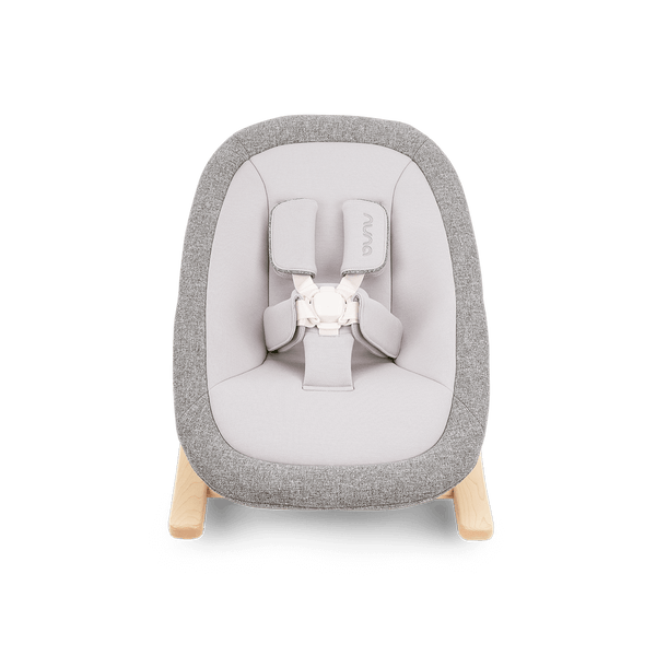 Gray and white fabric Nuna BRYN highchair and newborn rocker bundle with wooden legs for infant comfort and feeding
