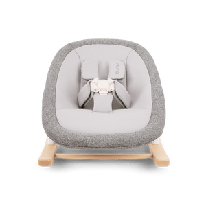 Nuna bryn newborn rocker with gray textured fabric, light wood base, and white safety harness for infants