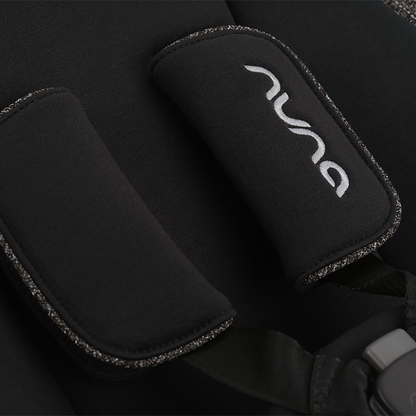 Black neoprene padded shoulder strap with silver embroidered Nuna logo and textured edge trim for Nuna BRYN newborn rocker