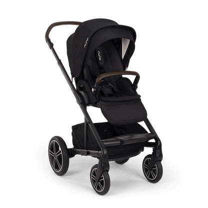 Black nuna mixx next stroller with sleek metal frame and wooden handle accents in caviar color shown from the back side