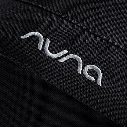 Black textured fabric with white embroidered nuna logo on caviar nuna mixx next stroller seat material