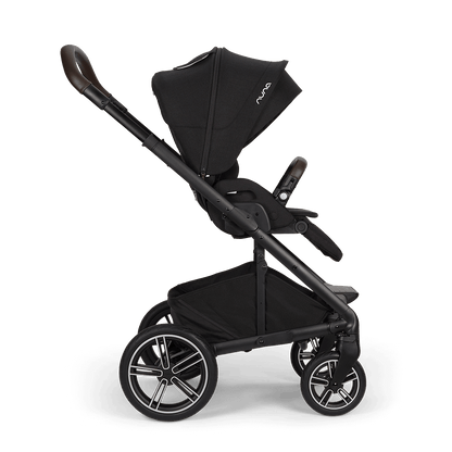 Black nuna mixx next stroller with sleek frame leather-like handle grips and silver-accented wheels in caviar color