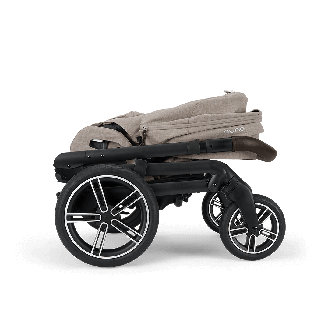 Beige fabric nuna mixx next stroller with black frame and silver-accented wheels featuring a sleek modern design