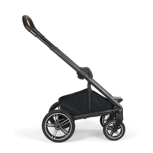 Black Nuna MIXX NEXT stroller with sleek frame brown leather handle and silver accented wheels shown from the back side