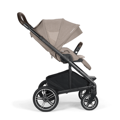 Beige and black nuna mixx next stroller with sleek modern design padded handle grips and multi-spoke wheels