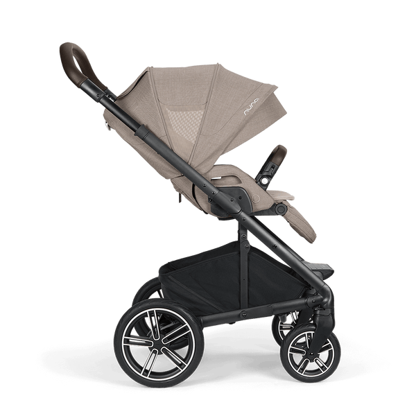 Beige and black nuna mixx next stroller with sleek modern design padded handle grips and multi-spoke wheels