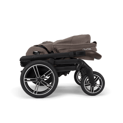 Nuna mixx next stroller in chestnut brown fabric with black frame and silver accented wheels featuring sleek design
