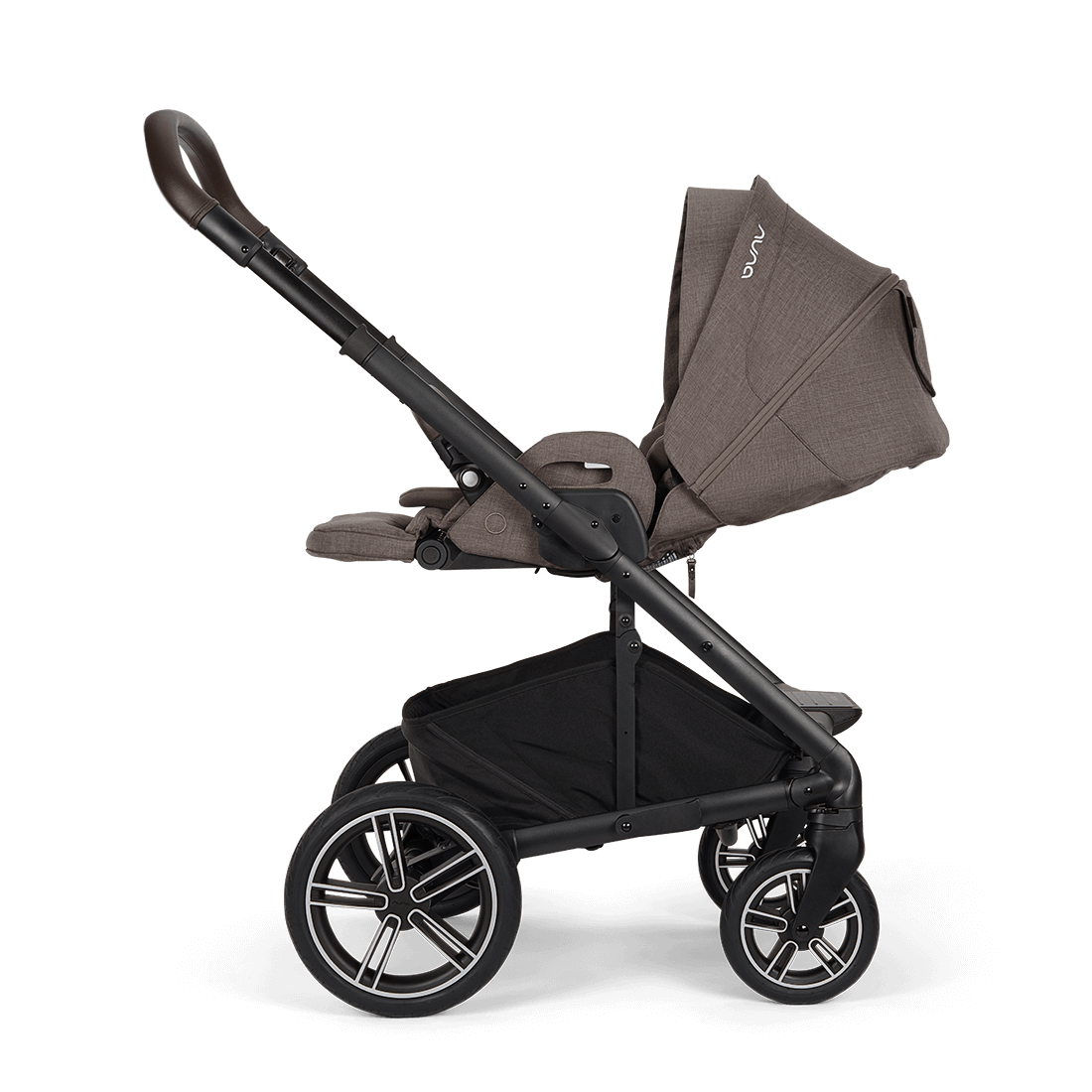 Nuna mixx next stroller in chestnut with brown and black fabric upholstery and stylish alloy wheels viewed from the back