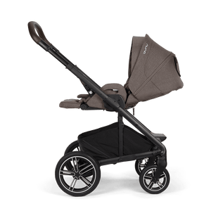 Nuna mixx next stroller in chestnut with brown and black fabric upholstery and stylish alloy wheels viewed from the back