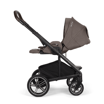 Nuna mixx next stroller in chestnut with brown and black fabric upholstery and stylish alloy wheels viewed from the back