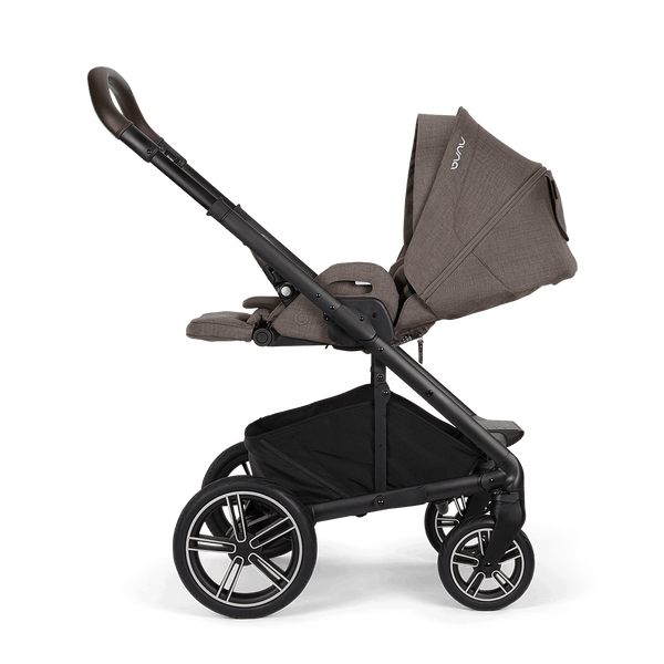 Nuna mixx next stroller in chestnut with brown and black fabric upholstery and stylish alloy wheels viewed from the back