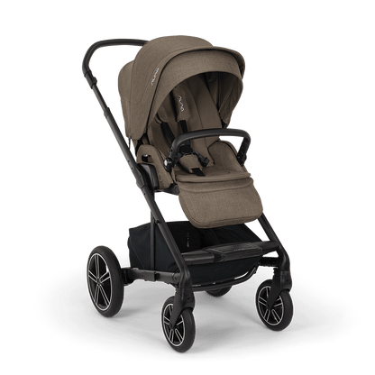 Nuna mixx next stroller in pistachio with tan fabric seat and sleek black metal frame and wheels
