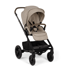 Beige quilted fabric Nuna MIXX NEXT stroller with black metal frame and wheels featuring a sleek modern design