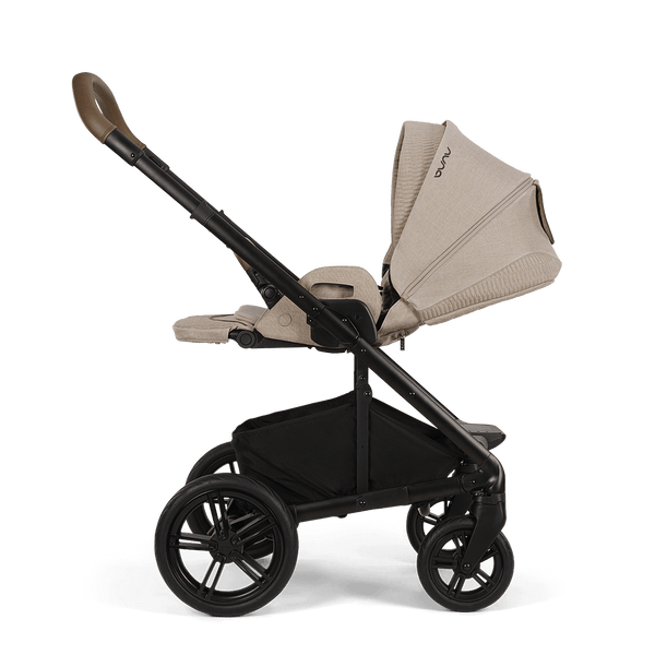 Beige and black nuna mixx next stroller cosmopolitan with fabric canopy and handle featuring sleek modern design