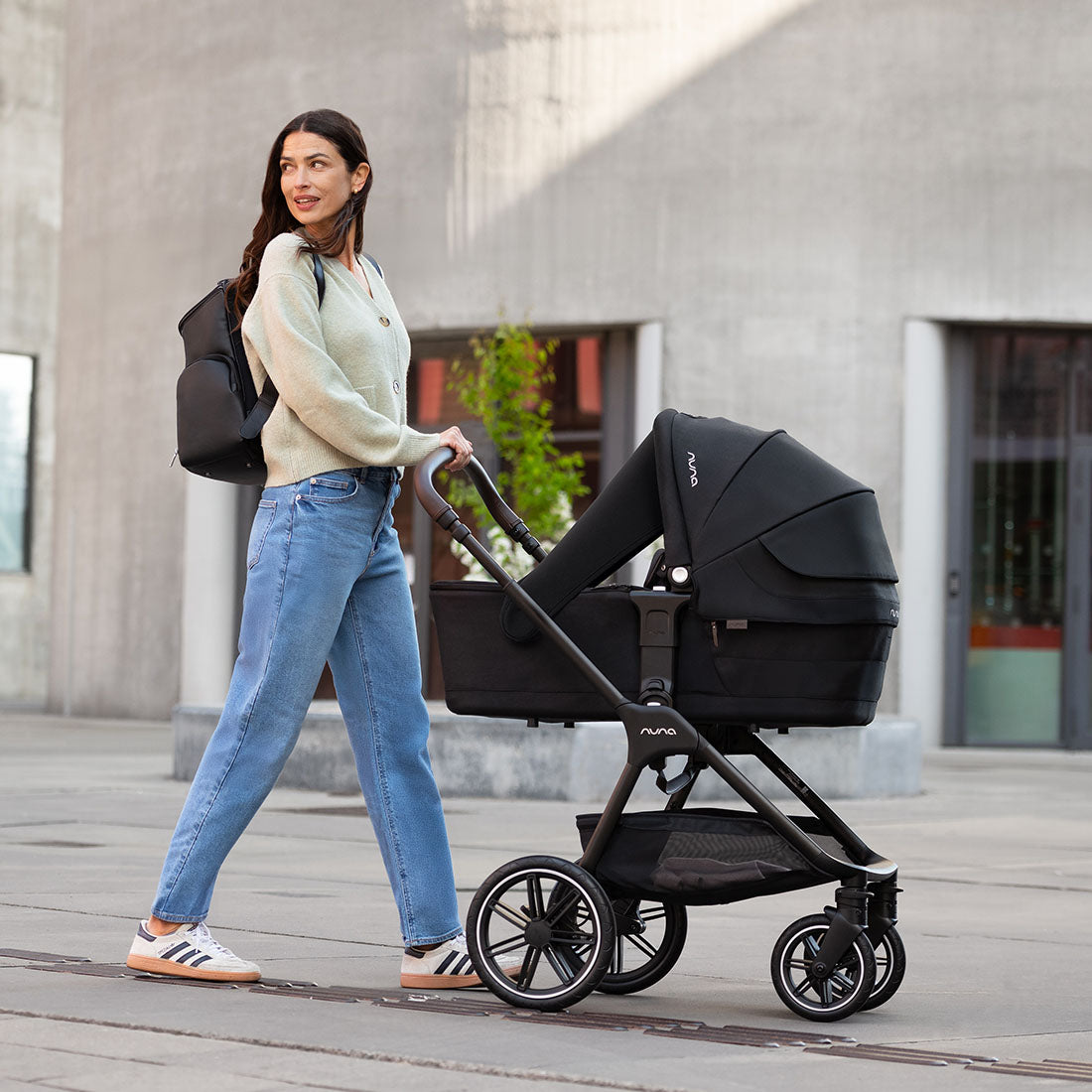 Black nuna stroller with a sleek, modern design and four wheels