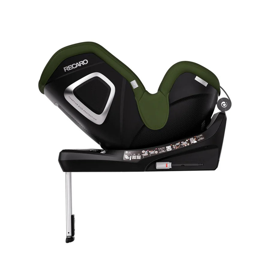 Epic Green TORON 1 KID, reclined rear-facing side view showing silver-trimmed shell and extended support leg.