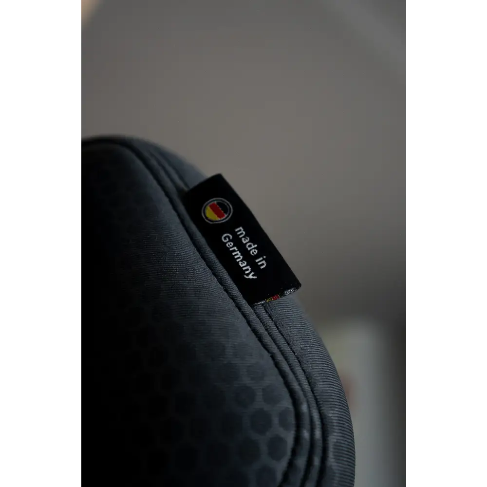 Close-up of Gallant Grey upholstery with double stitching and a Made in Germany fabric label.