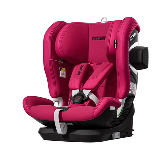 Recaro VELIX 1 in Wow Pink, angled front view with padded harness and a black attachment on the outer side wing.