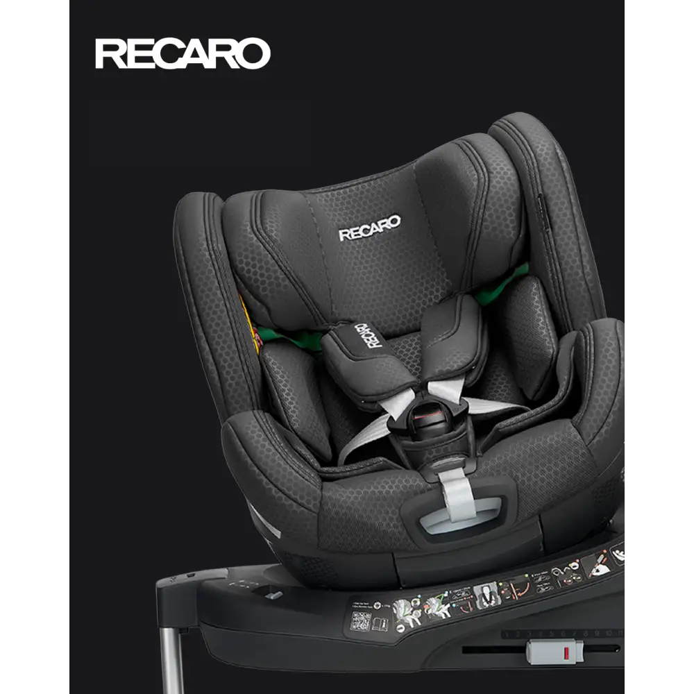Recaro Fresh Black XENON 1 KID, rotated on its base with padded harness beneath a white Recaro logo.
