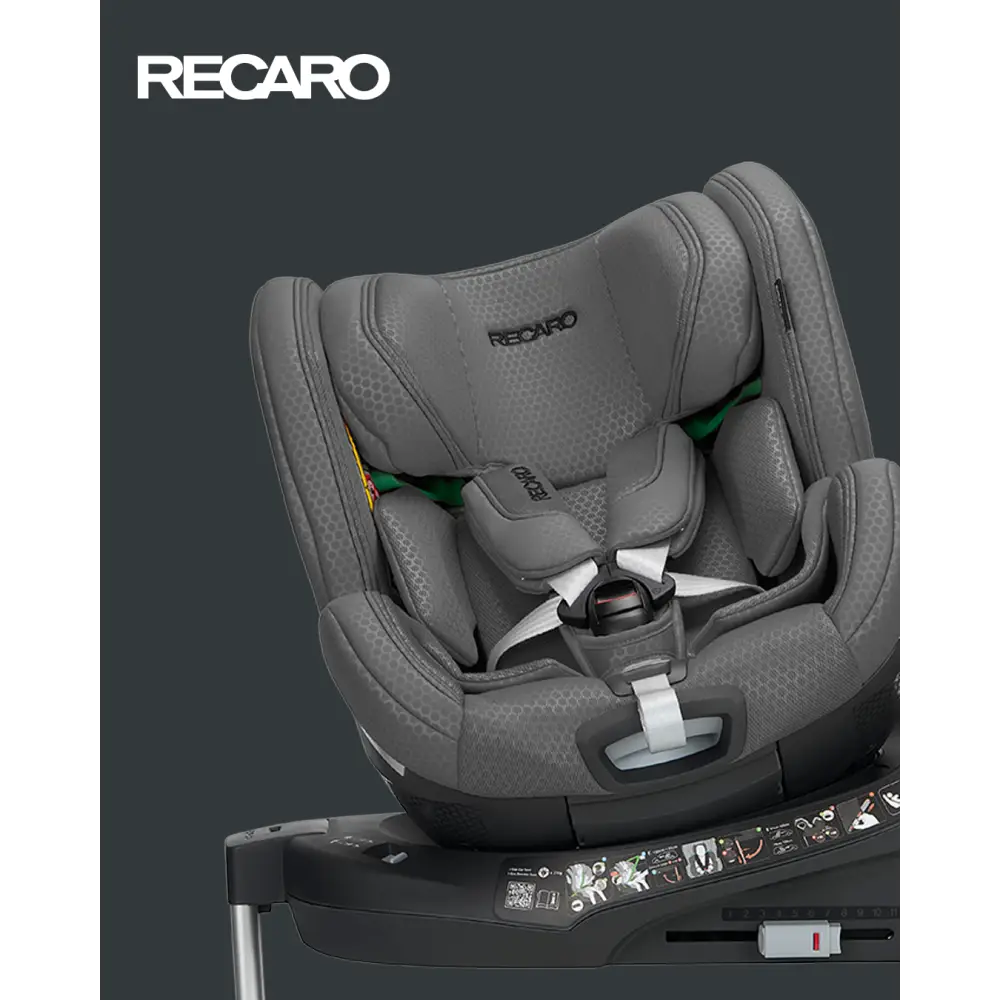 Gallant Grey XENON 1 KID, rotated on its base with padded harness beneath a white Recaro logo.