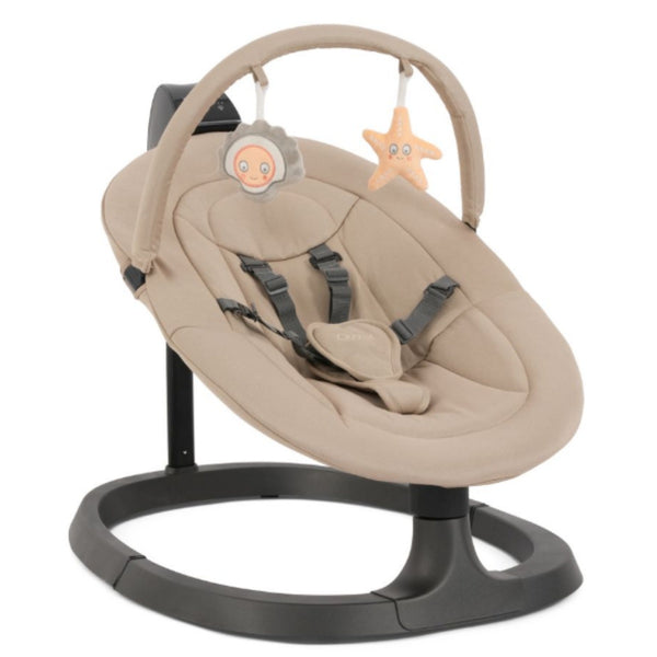 Beige babystyle oyster ocean rocker baby swing with black base and plush star and face-shaped hanging toys